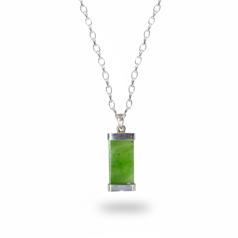 Nephrite jade pendant with deep green tones set in sterling silver necklace