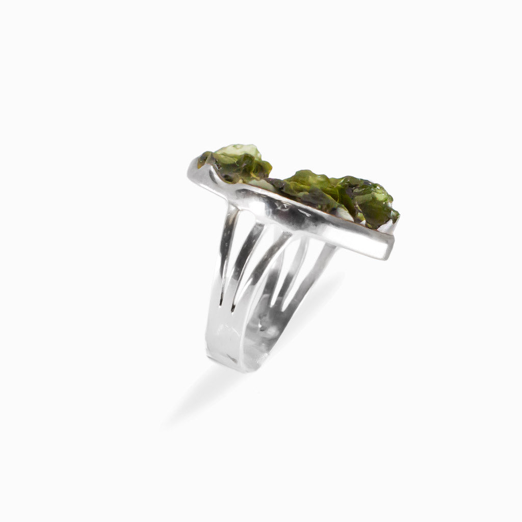 Raw freeform olive-green Moldavite ring with natural textured surface set in polished 925 sterling silver.