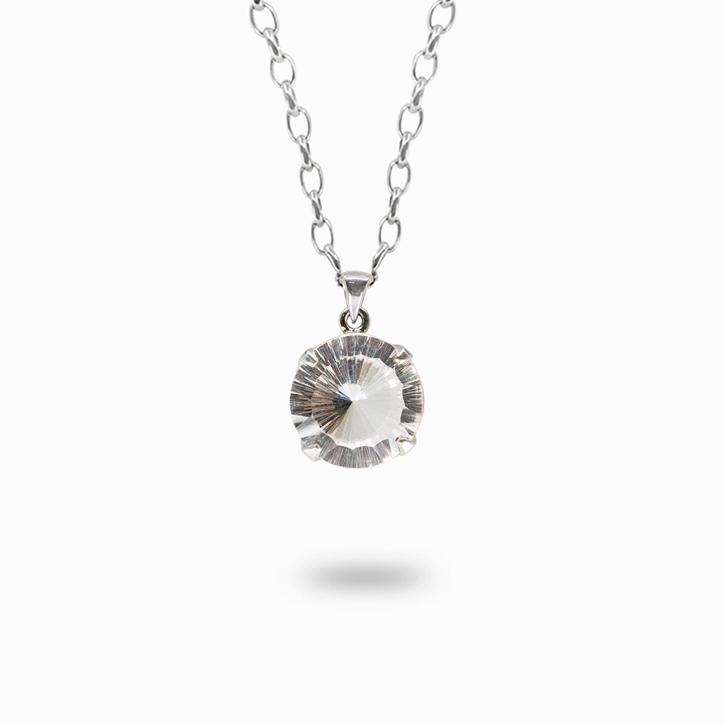 Round Clear Quartz pendant necklace featuring transparent radial-cut facets in a polished sterling silver prong setting.