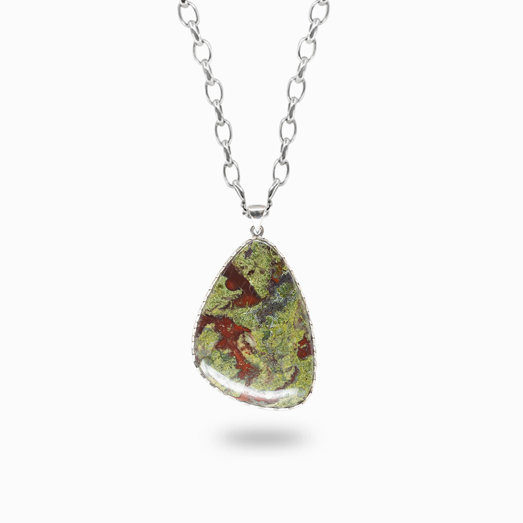 Freeform teardrop Dragon's Blood Jasper pendant necklace with red and green marbled patterns in a textured sterling silver setting.