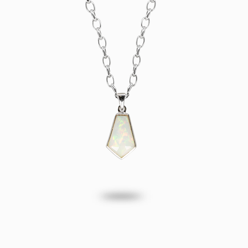 Faceted geometric Precious Opal pendant necklace with a milky white body and iridescent green and pink flashes in sterling silver.
