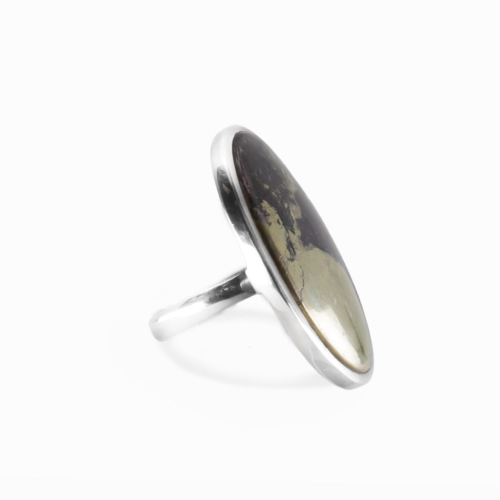 Apache Gold oval cabochon ring in polished sterling silver featuring contrasting black and naturally metallic golden mineral tones.