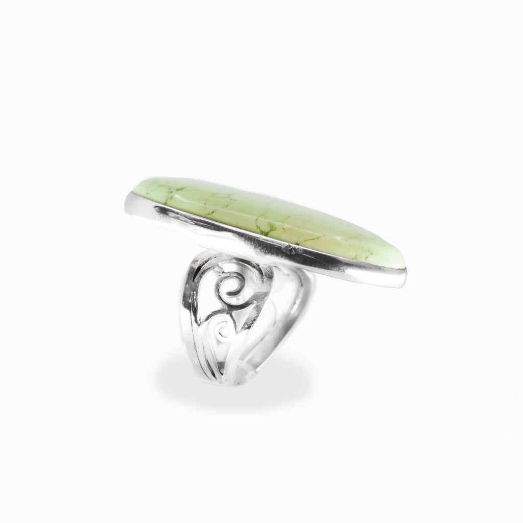 Lemon Chrysoprase oval cabochon ring in polished sterling silver with a luminous pale yellow-green color and delicate natural veining.