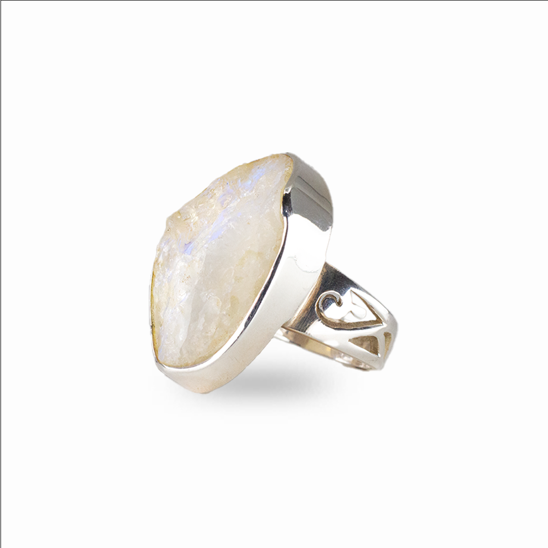 Raw rainbow moonstone ring with white stone and blue flash set in silver