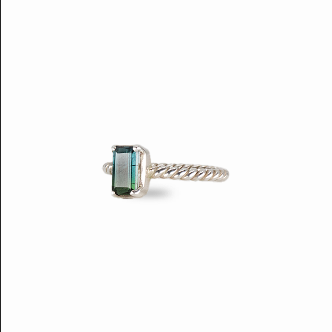Faceted rectangle blue tourmaline ring set in sterling silver with emerald-cut gemstone