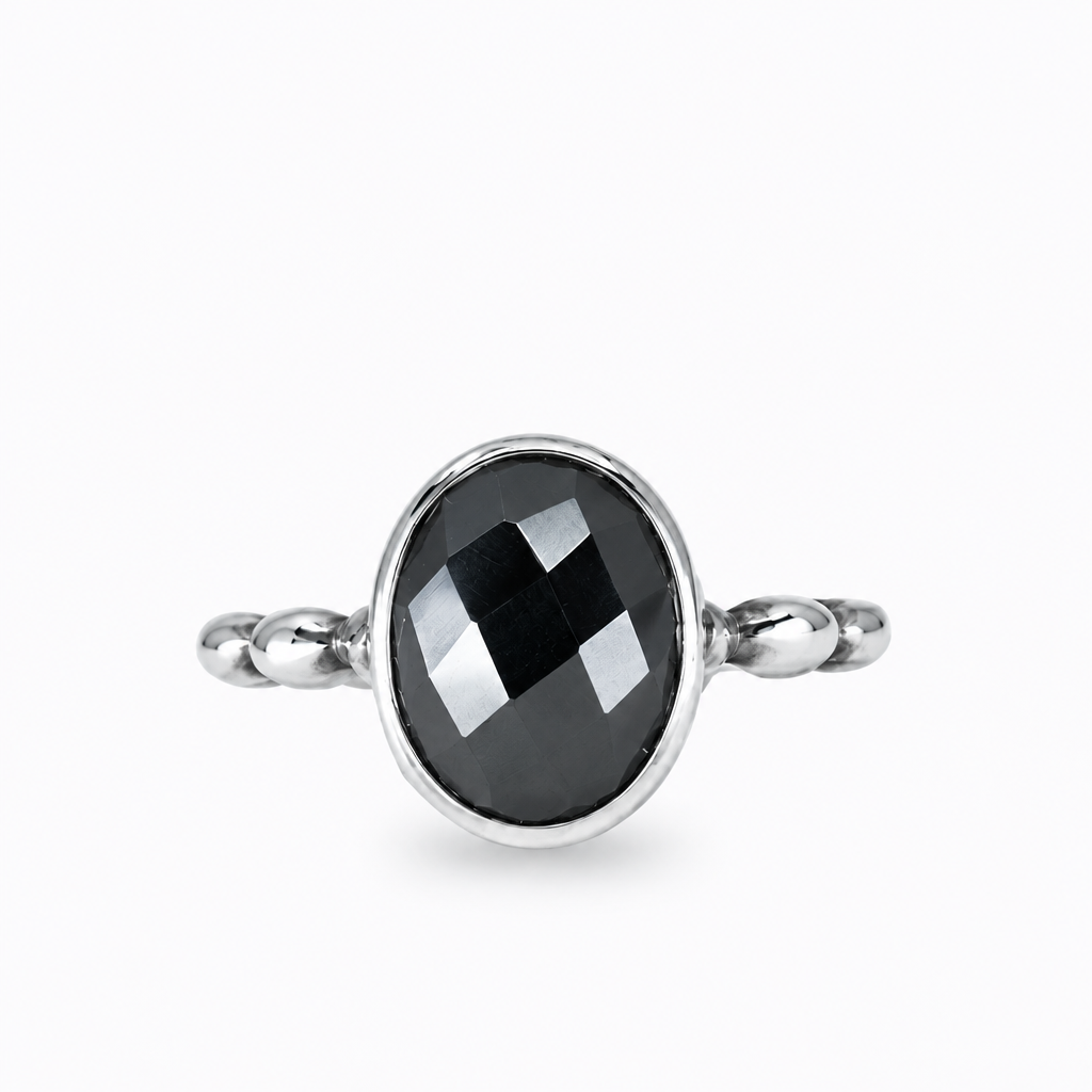 Faceted oval hematite ring with metallic black gemstone set in sterling silver