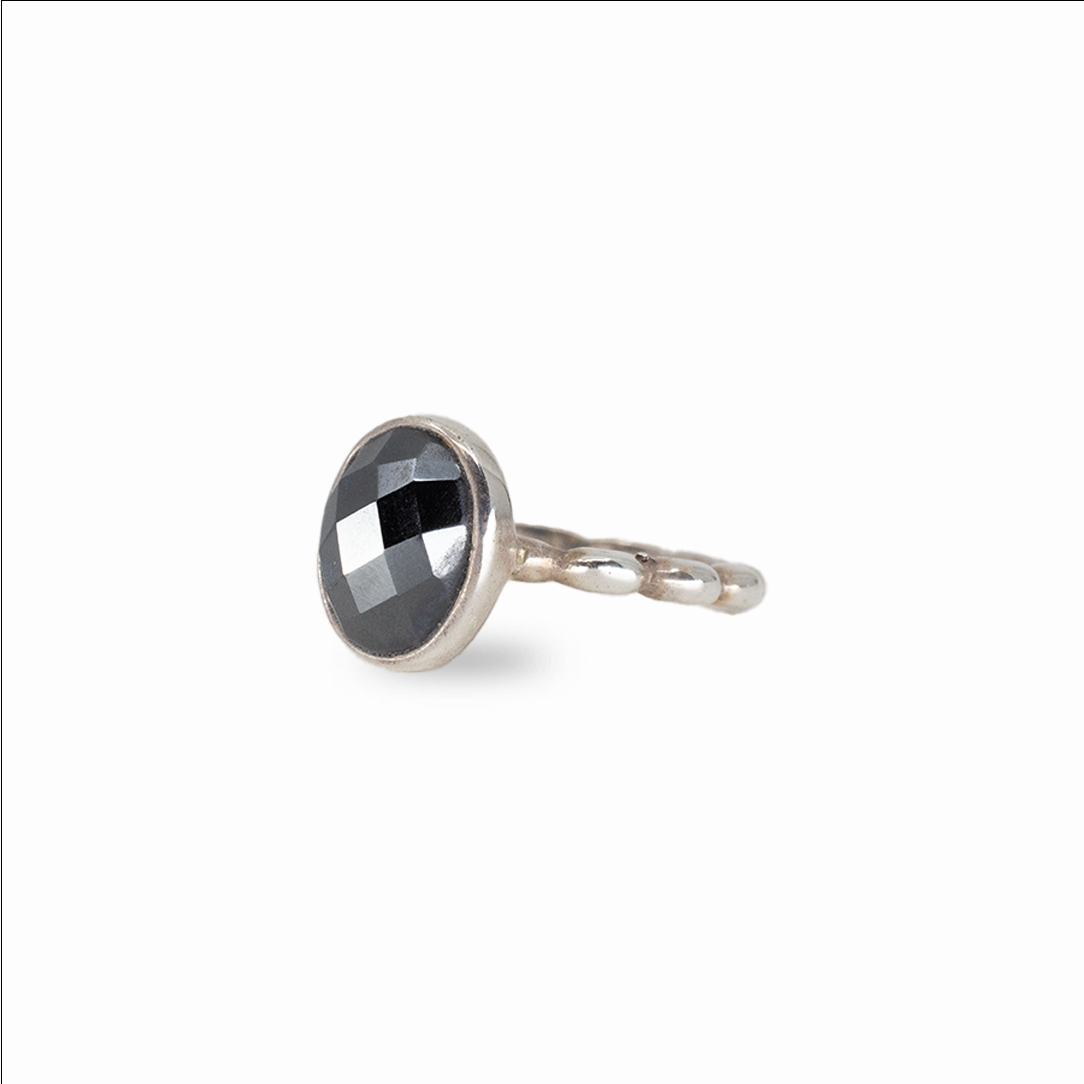 Faceted oval hematite ring with metallic black gemstone set in sterling silver