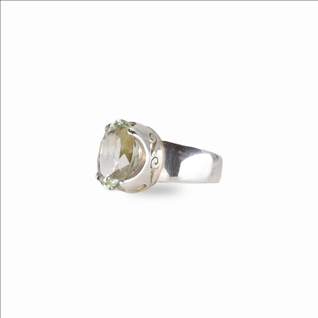 Oval mint green quartz gemstone ring set in sterling silver on white background