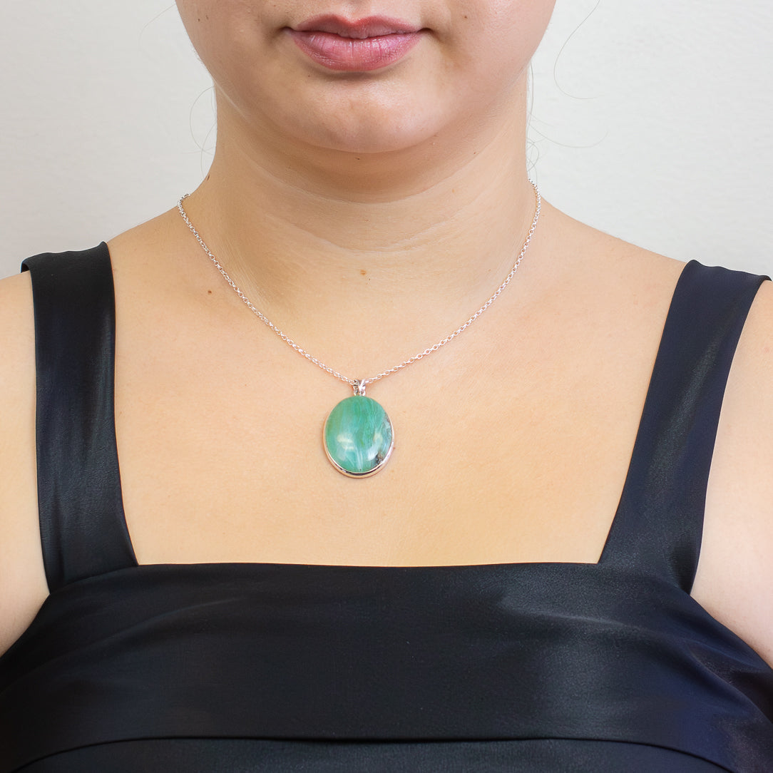 Oval Andean Opal pendant with swirling aqua and green patterns, set in sterling silver on a chain. | MADE IN EARTH