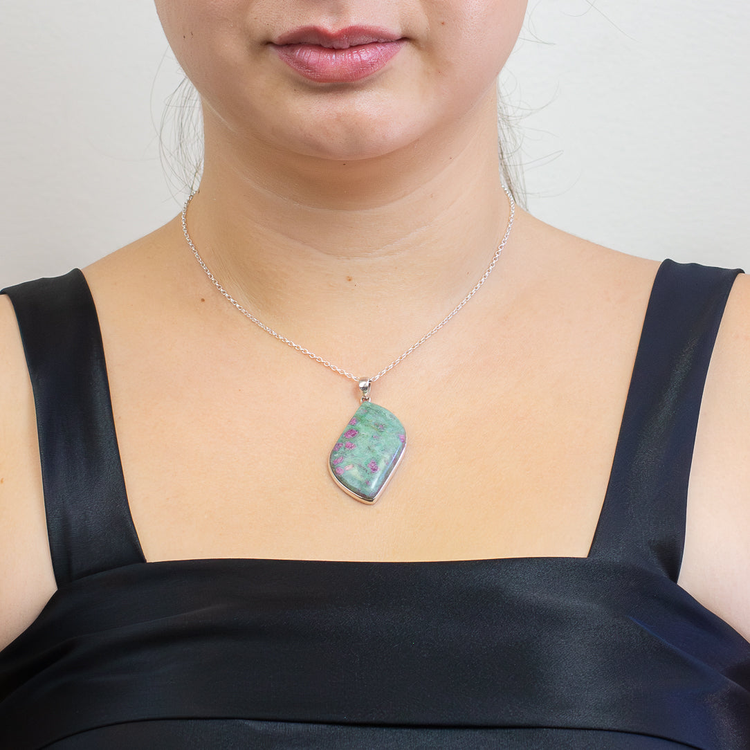 Organic-shaped Ruby Fuchsite pendant featuring magenta ruby crystals in a soft green matrix, set in polished sterling silver on a chain | MADE IN EARTH