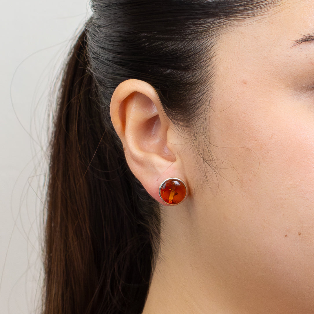 cabochon round amber stud earrings on model