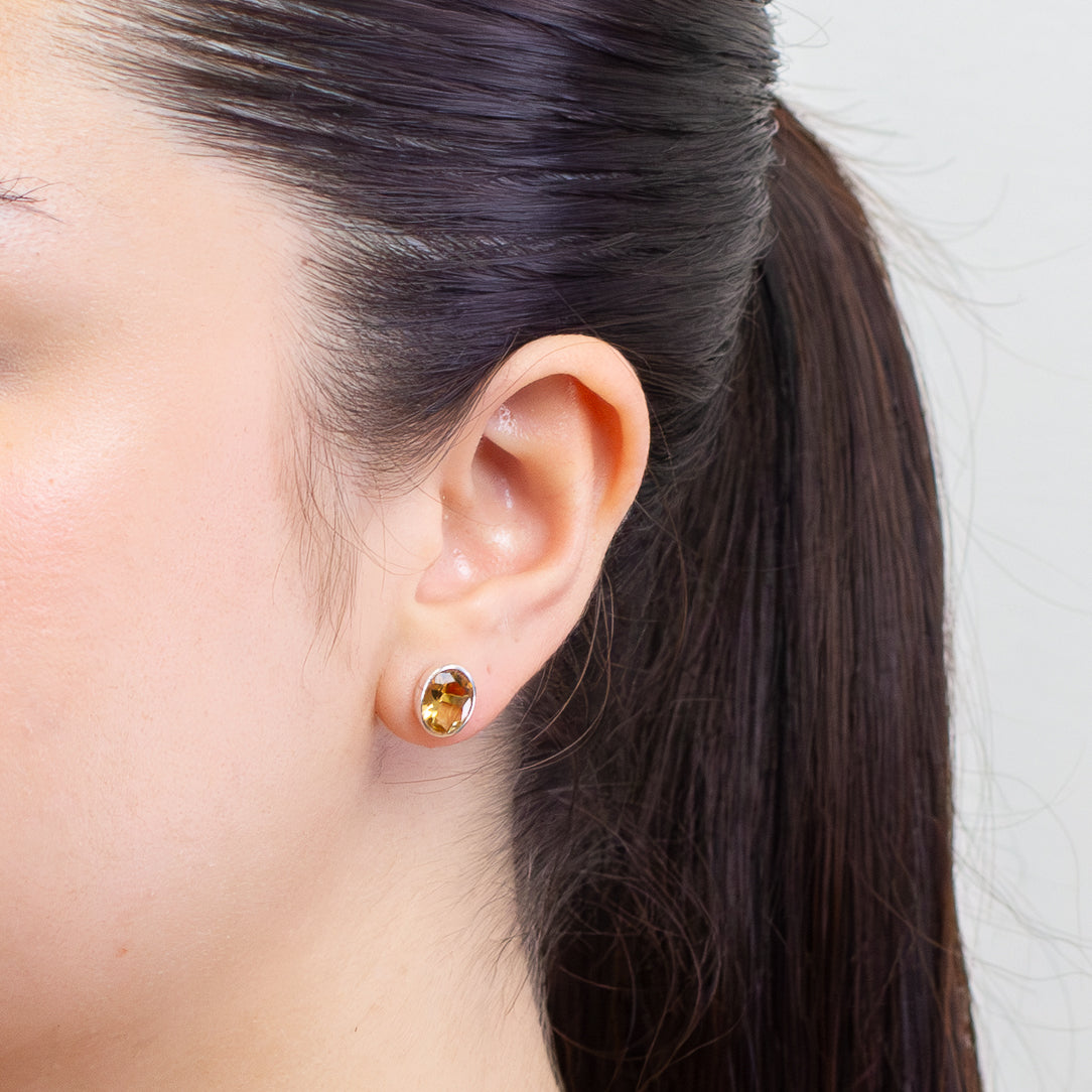 FACETED OVAL CITRINE STUD EARRINGS ON MODEL