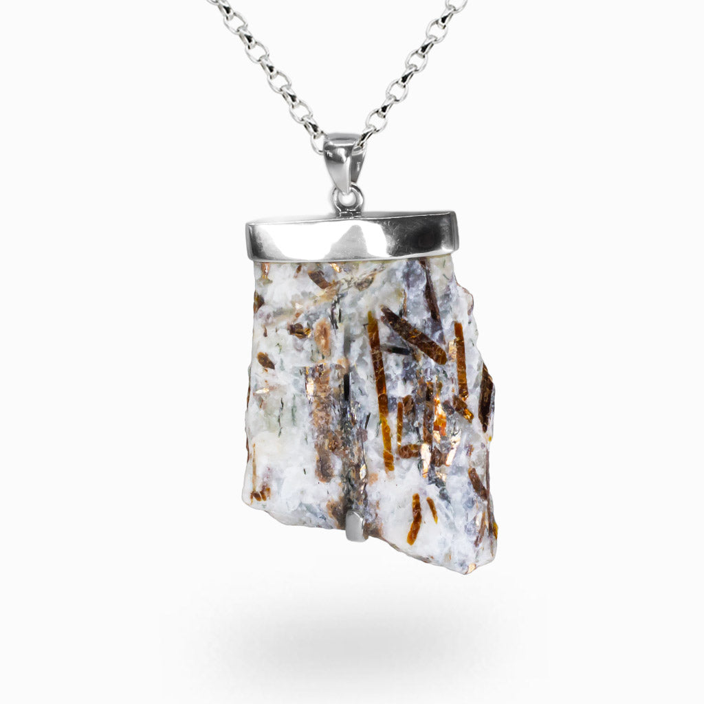 Raw Astrophyllite crystal necklace with bronze blade inclusions set in sterling silver. | MADE IN EARTH