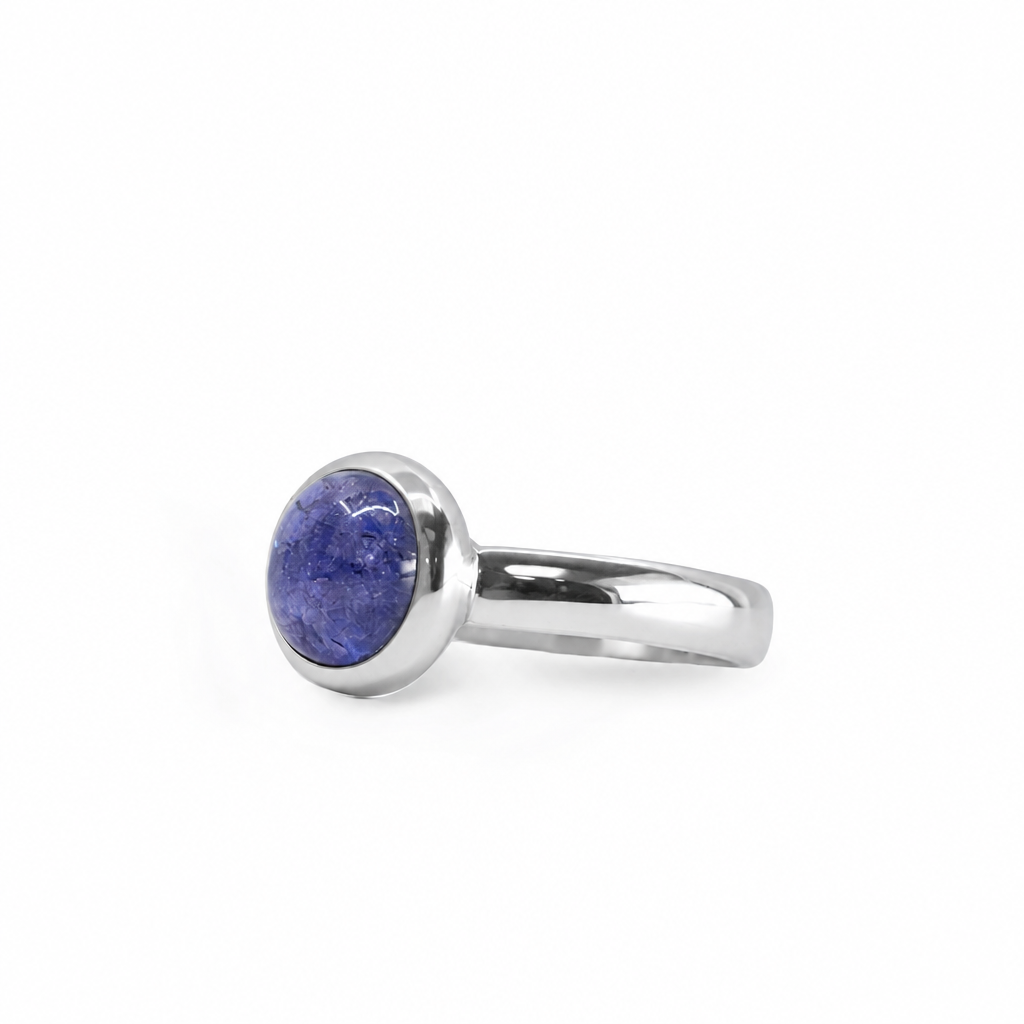 Round violet-blue Tanzanite cabochon ring in polished 925 sterling silver with a smooth bezel setting and classic band.