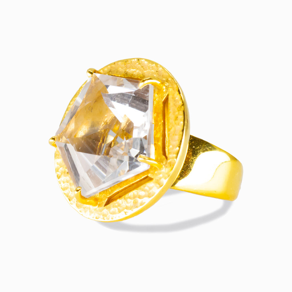 Faceted clear quartz star-cut ring set in a hammered yellow gold vermeil bezel. | MADE IN EARTH