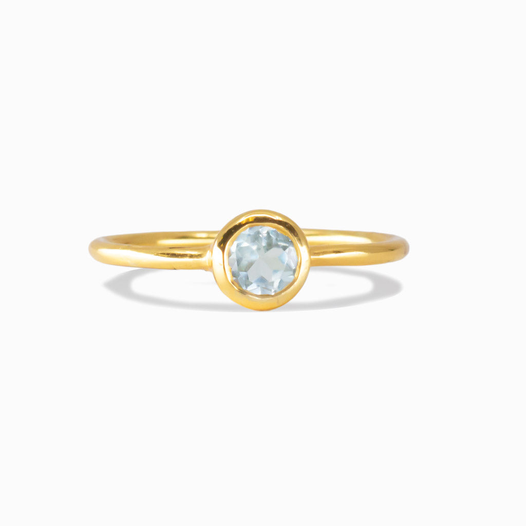 Round blue topaz gold vermeil ring with a minimalist bezel setting | MADE IN EARTH