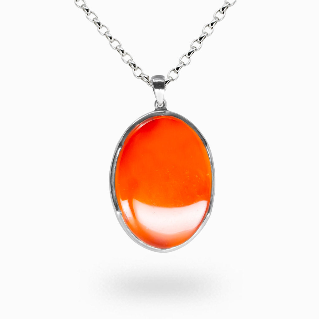 Oval carnelian necklace set in sterling silver with polished red orange cabochon gemstone pendant | MADE IN EARTH