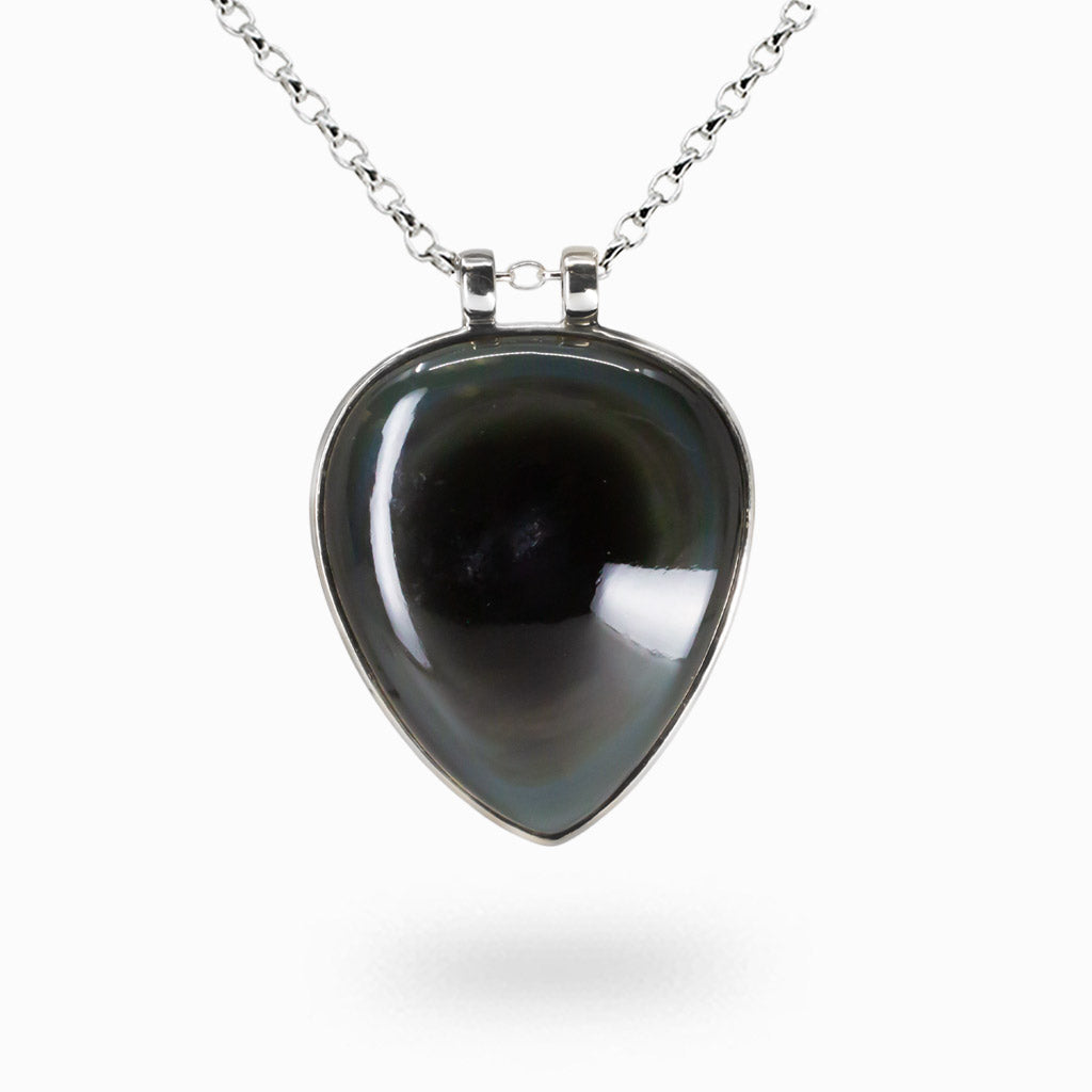 Teardrop-shaped rainbow obsidian necklace with glossy black surface and subtle iridescent color bands. | MADE IN EARTH