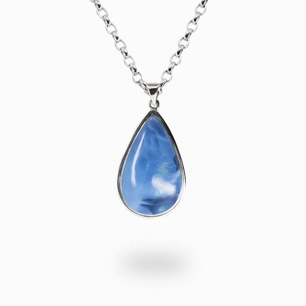 Blue opal teardrop cabochon necklace in sterling silver bezel with soft blue and white color variations and polished natural gemstone finish.| MADE IN EARTH