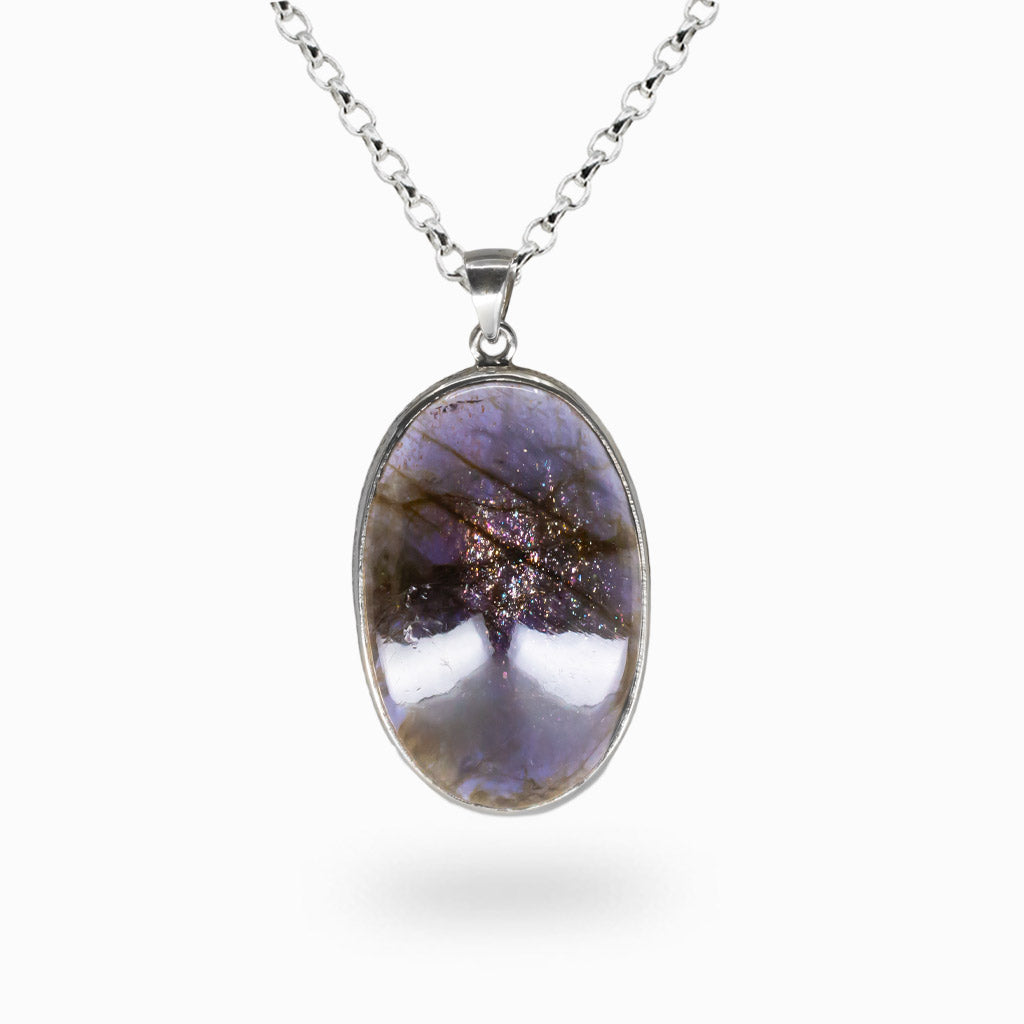 Oval iolite cabochon pendant in sterling silver setting on chain. MADE IN EARTH