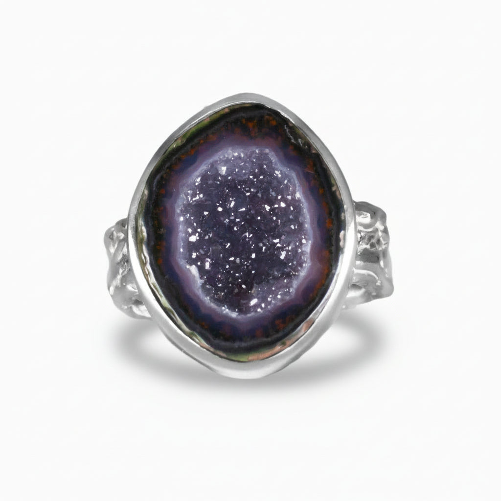 Purple Agate geode druzy ring with sparkling crystal center and sterling silver bezel textured band setting on a white background. | MADE IN EARTH