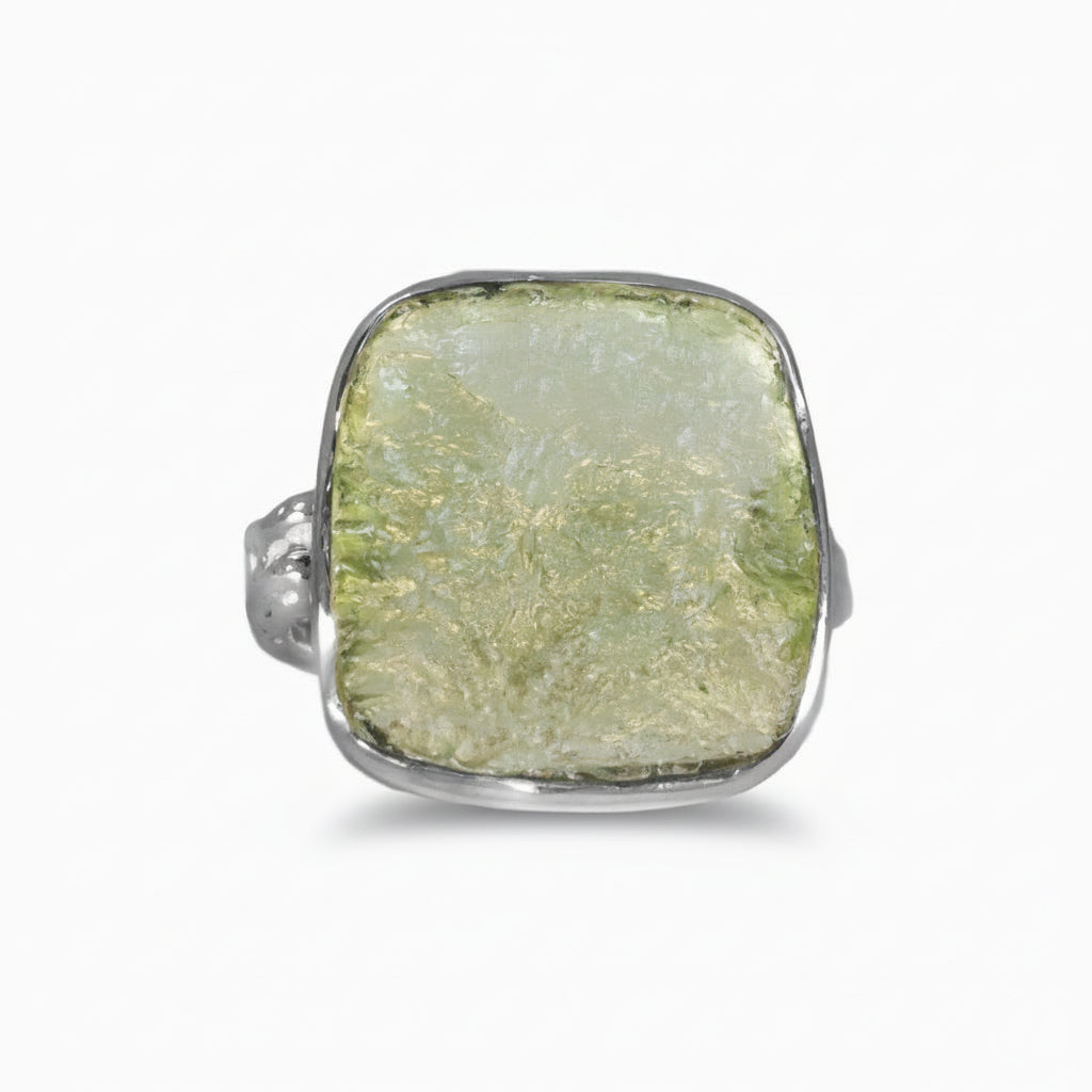 Raw square Moldavite ring set in sterling silver with natural olive-green texture on a white background. | MADE IN EARTH