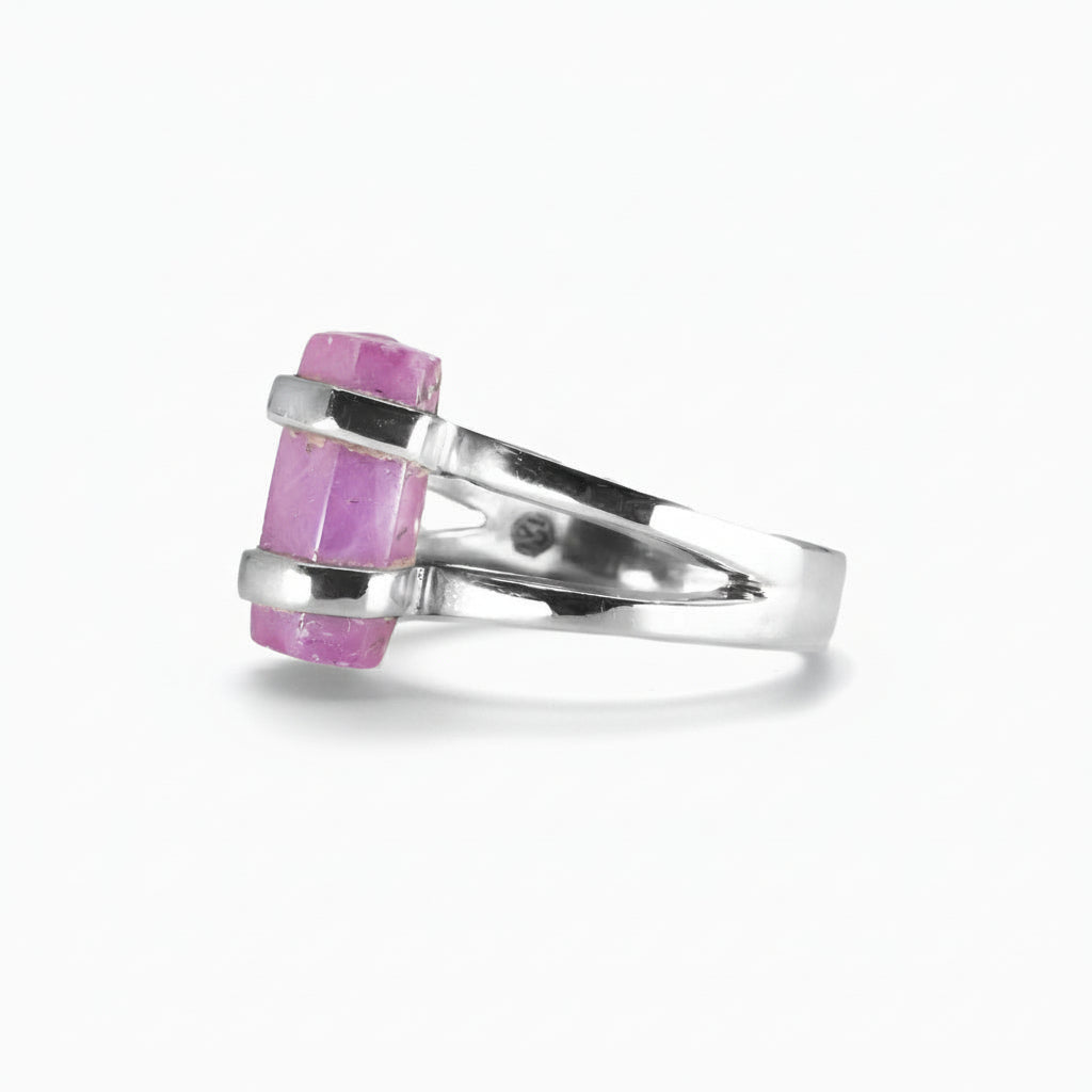 Raw pink-red Ruby pencil crystal ring set in sterling silver double-band design on a white background. MADE IN EARTH