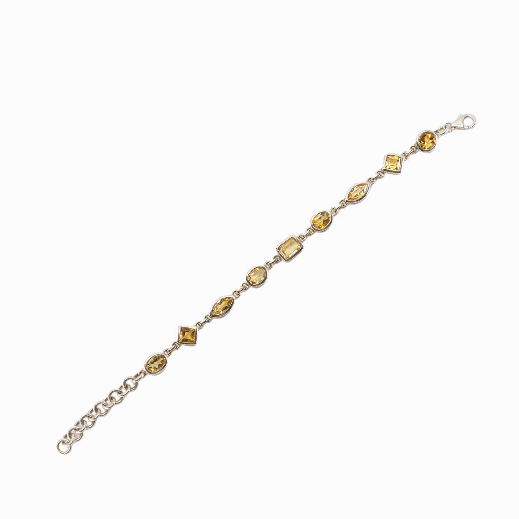Faceted Citrine bracelet in sterling silver with assorted gemstone shapes.