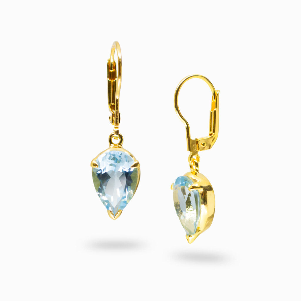 Faceted blue topaz teardrop earrings in 14k gold vermeil over sterling silver with bright blue gemstone