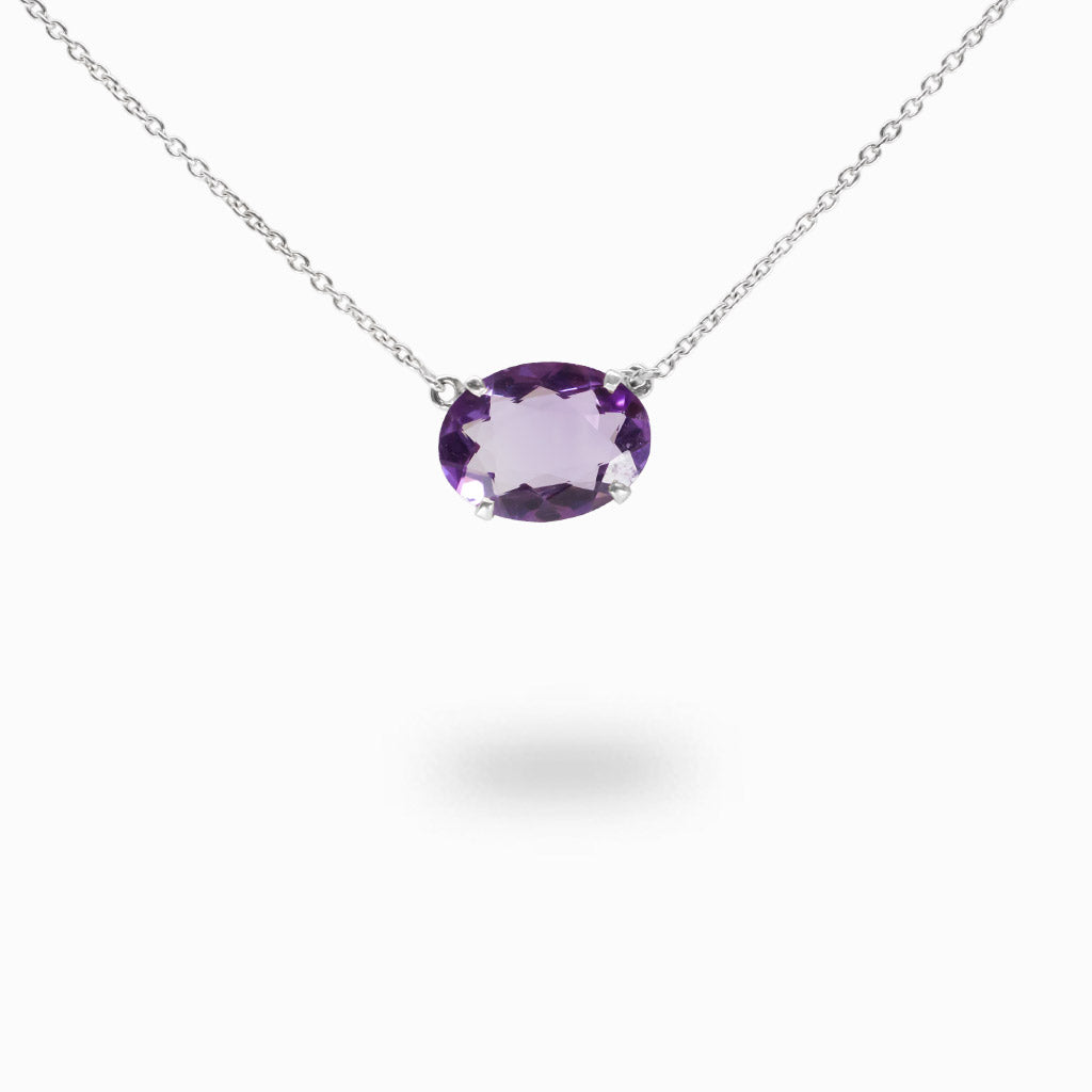 Faceted oval Amethyst necklace in sterling silver with purple gemstone.