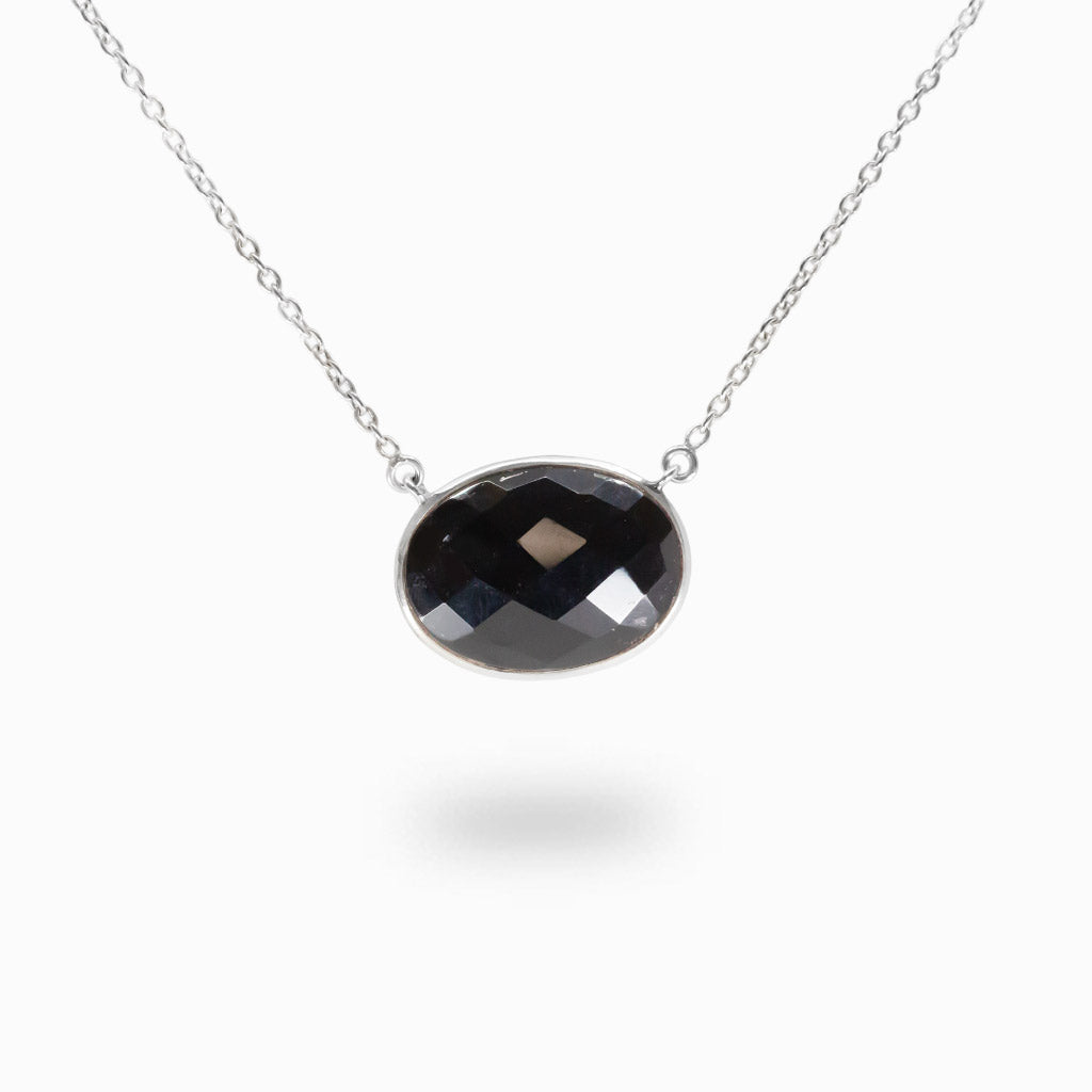 Faceted Black Onyx necklace in sterling silver with oval gemstone.