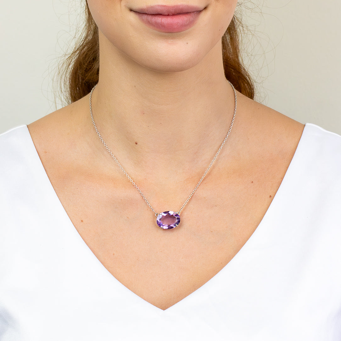 Faceted oval Amethyst necklace in sterling silver with purple gemstone.