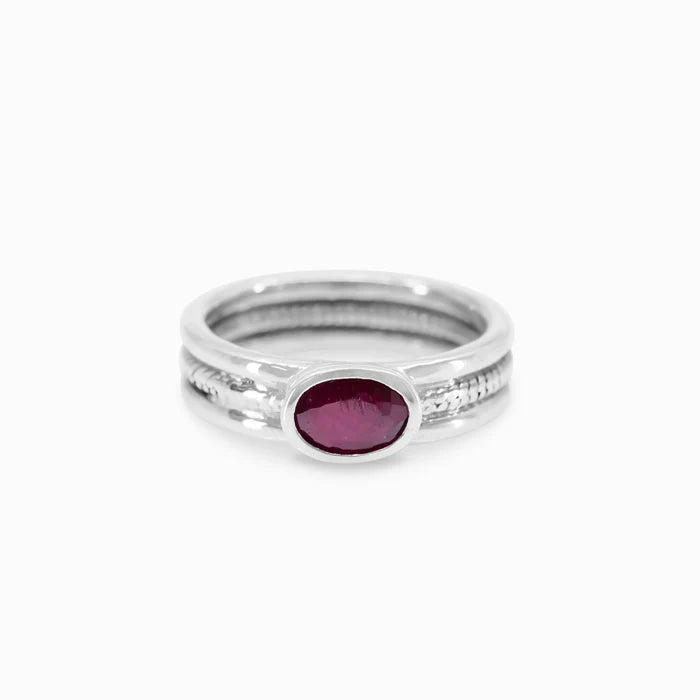 Oval Ruby gemstone bezel set in textured sterling silver triple-band ring.