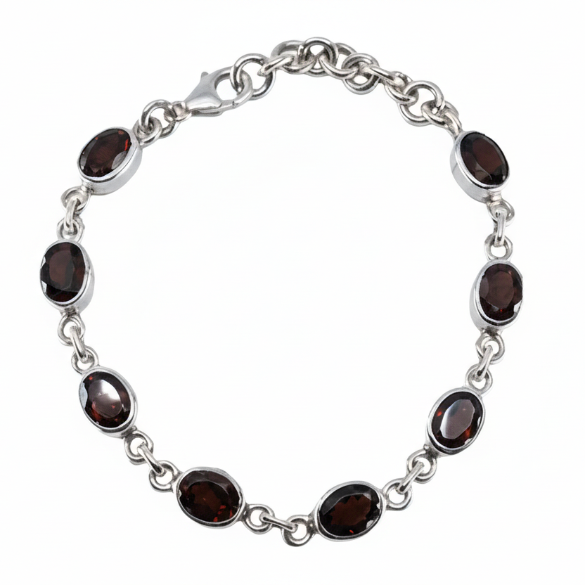 Faceted garnet bracelet with deep red gemstones in sterling silver