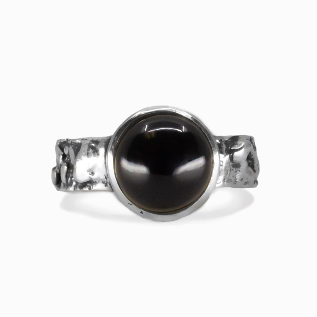 Onyx gemstone ring showing deep black stone set in a sterling silver band. | MADE IN EARTH