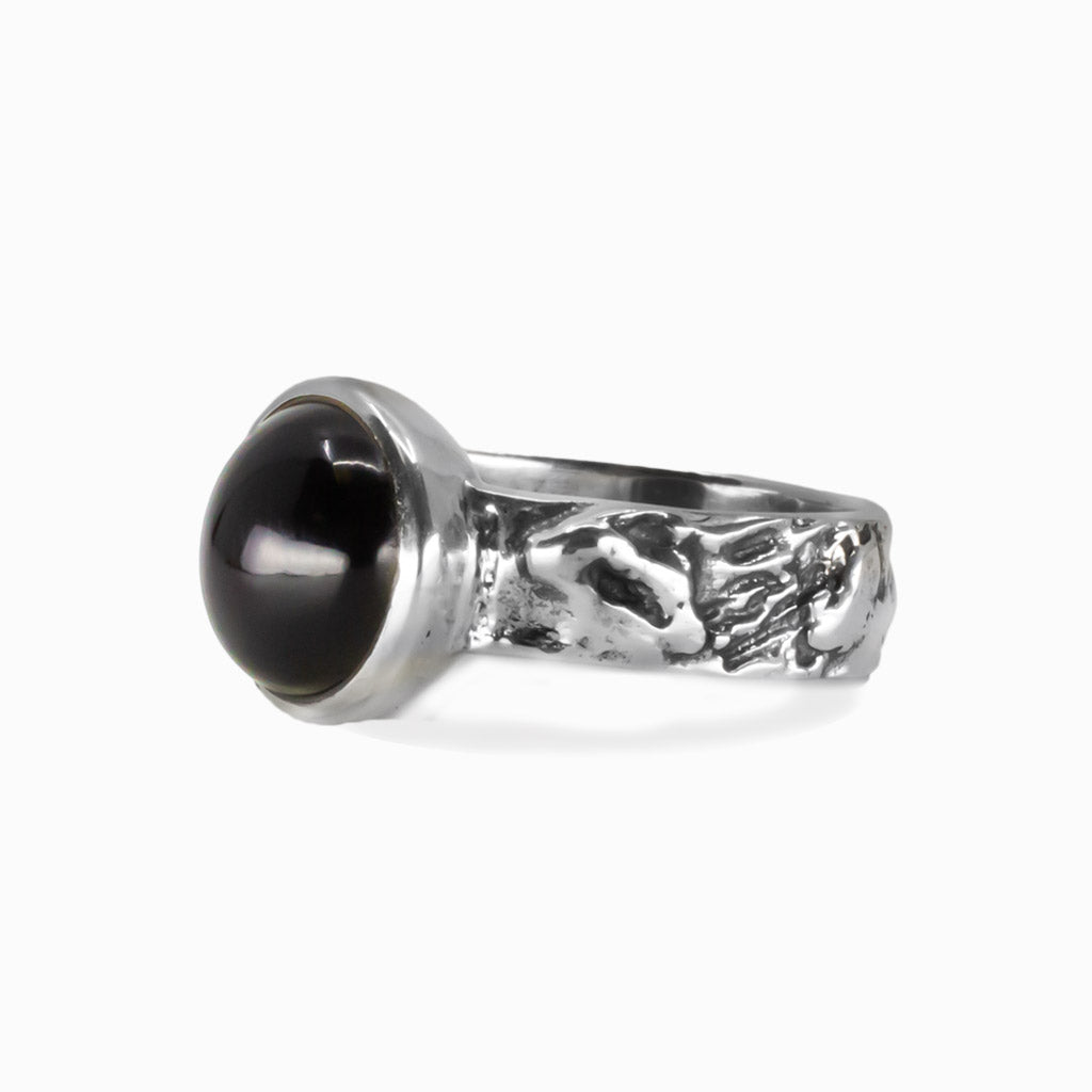 Onyx gemstone ring showing deep black stone set in a sterling silver band. | MADE IN EARTH