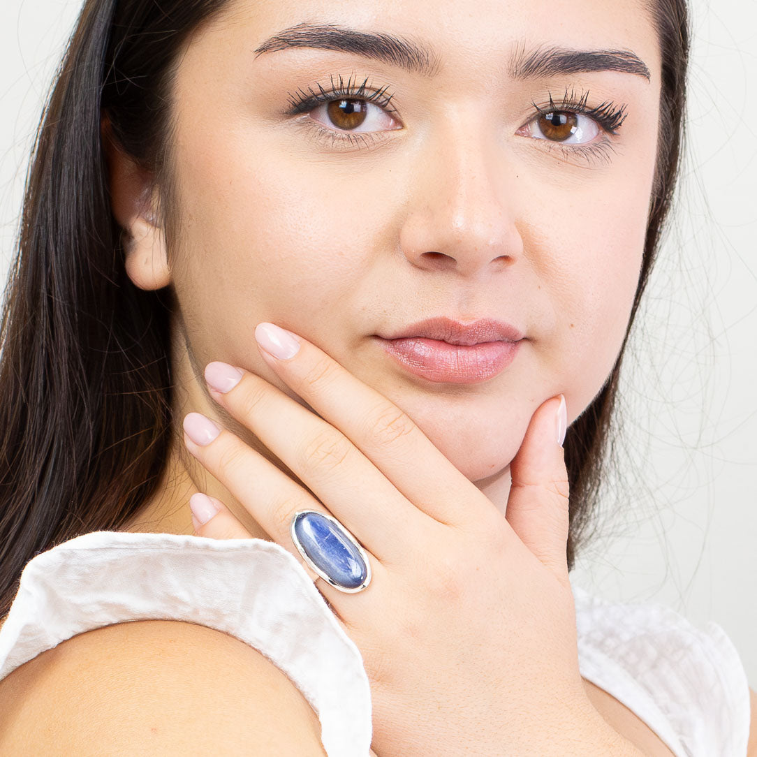 Large oval Kyanite cabochon ring in sterling silver with layered blue and white crystalline patterns. MADE IN EARTH