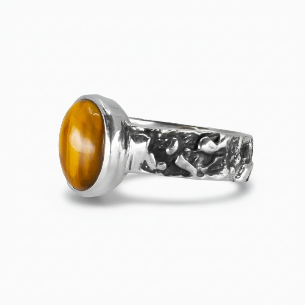 Oval Tiger Eye cabochon ring in textured sterling silver featuring golden-brown shimmering gemstone. |MADE IN EARTH