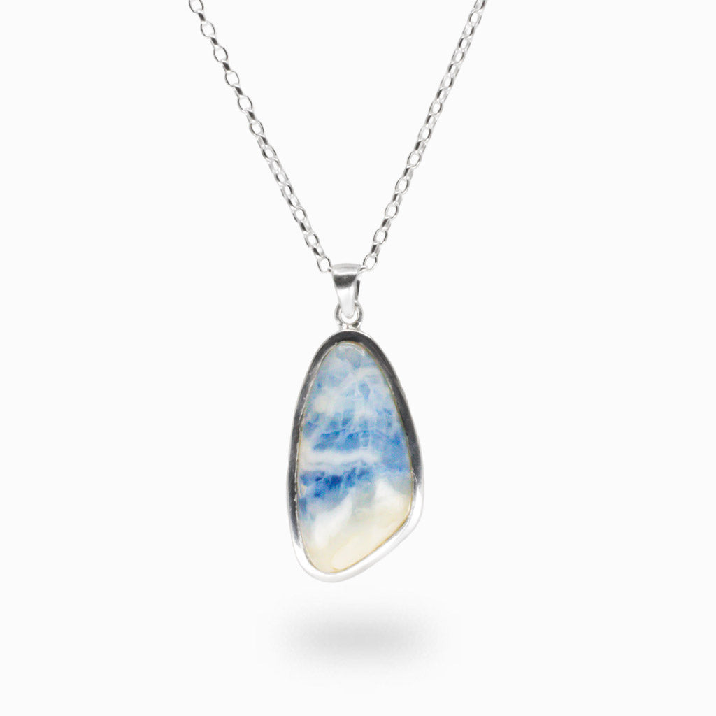 Blue Scheelite necklace in sterling silver with soft ocean blue and white layered cabochon stone. | MADE IN EARTH