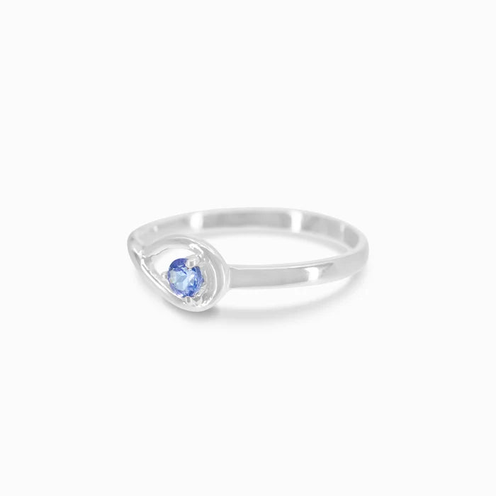 Round faceted Tanzanite gemstone prong set in polished sterling silver ring