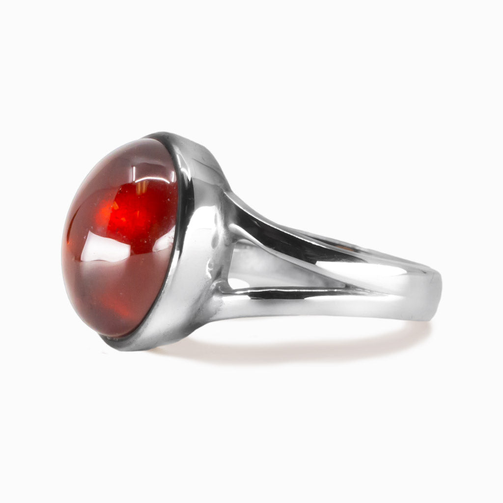 Oval hessonite garnet cabochon ring set in sterling silver with orange gemstone. MADE IN EARTH