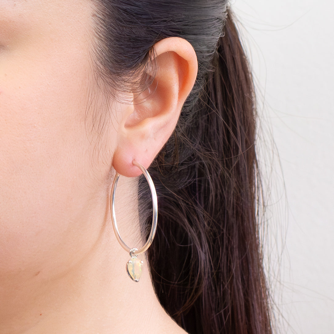 Faceted teardrop precious opal hoop charms with rainbow play-of-color in sterling silver