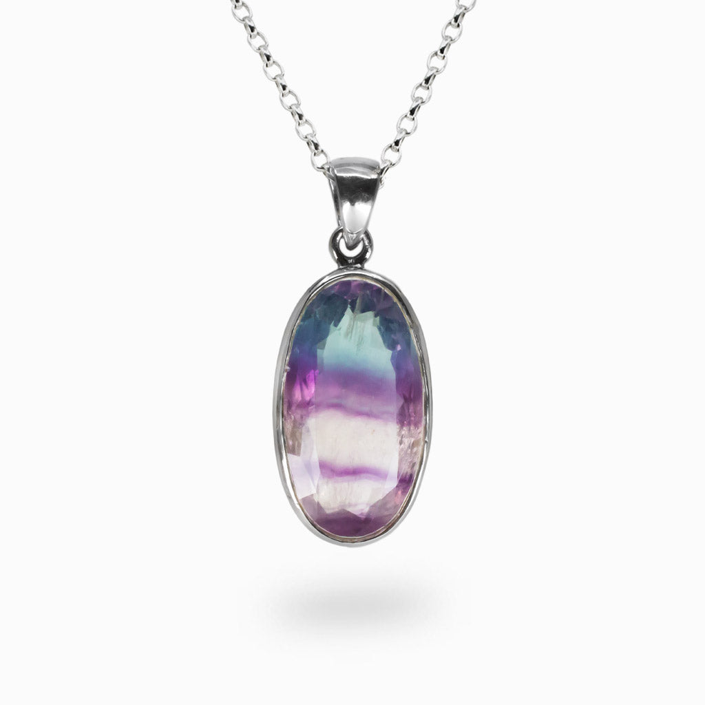 Faceted oval purple fluorite pendant set in sterling silver on a chain | MADE IN EARTH
