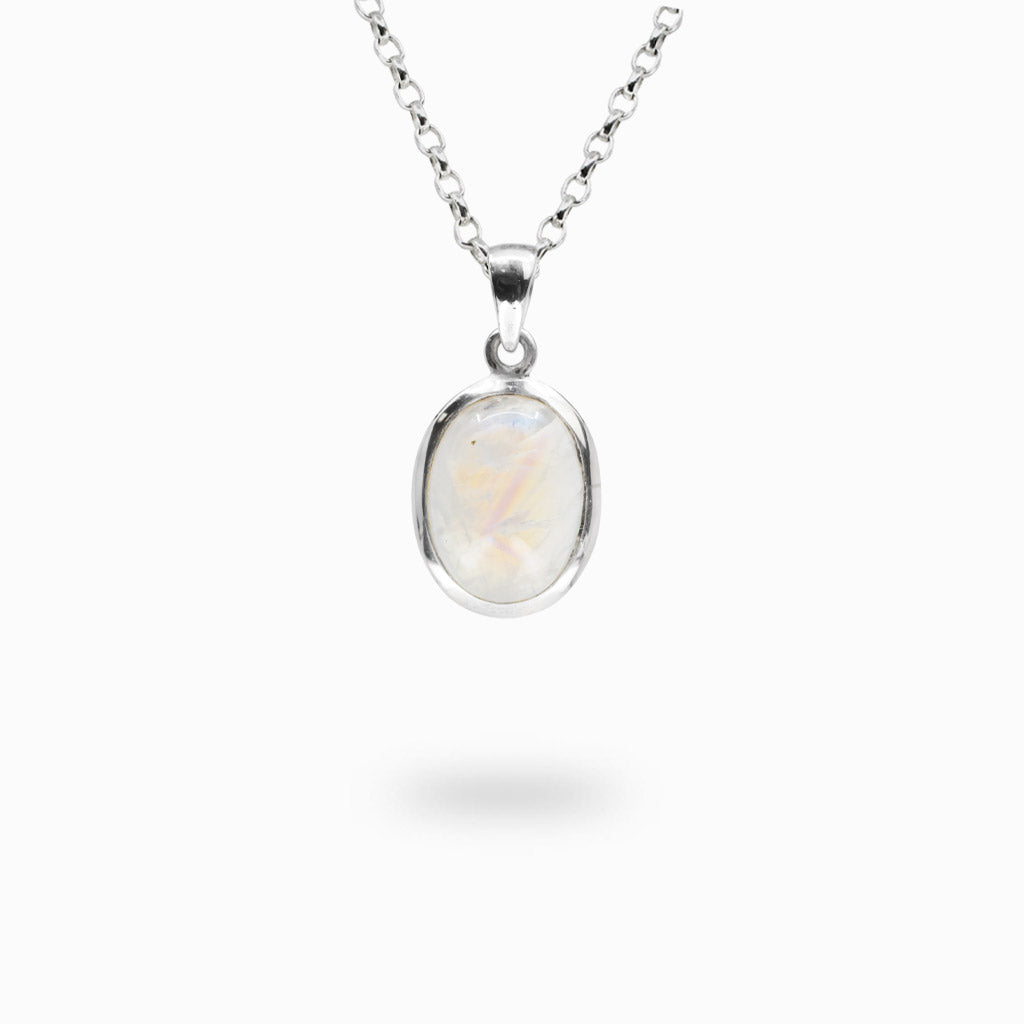 Oval Rainbow Moonstone gemstone pendant with natural iridescent flash handcrafted in sterling silver.