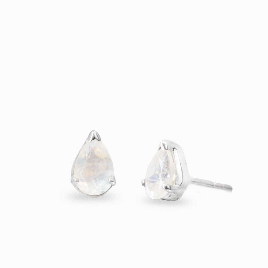 Faceted pear-shaped Rainbow Moonstone stud earrings in sterling silver with blue iridescence.