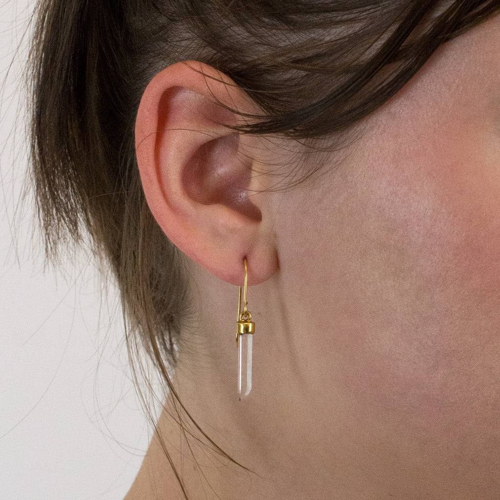 Laser Quartz drop earrings on model
