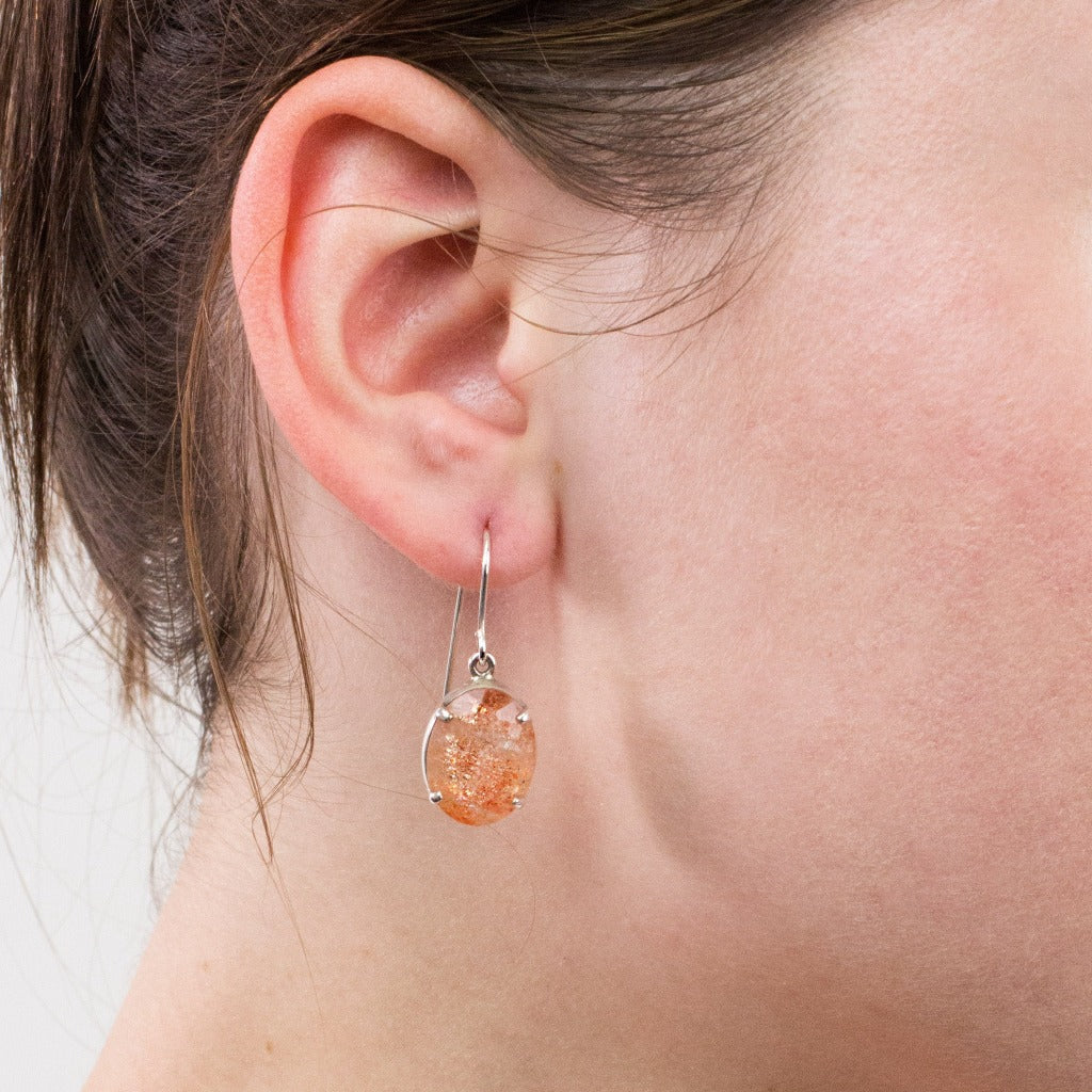Sunstone drop earrings on model