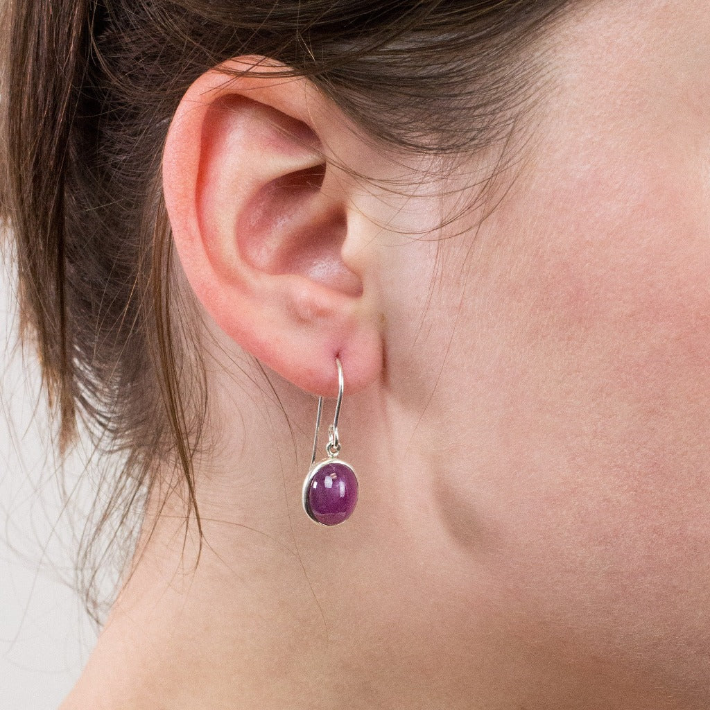 Ruby drop earrings on model