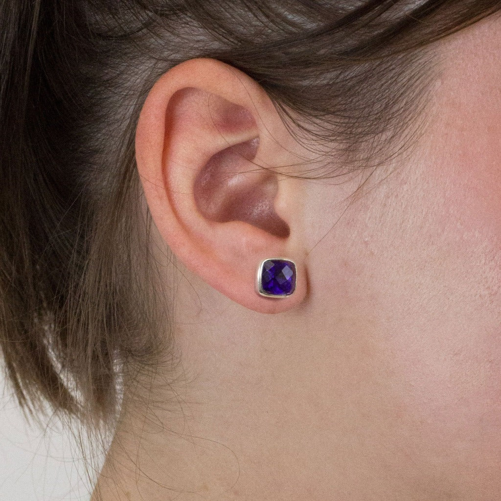 Amethyst stud earrings on model