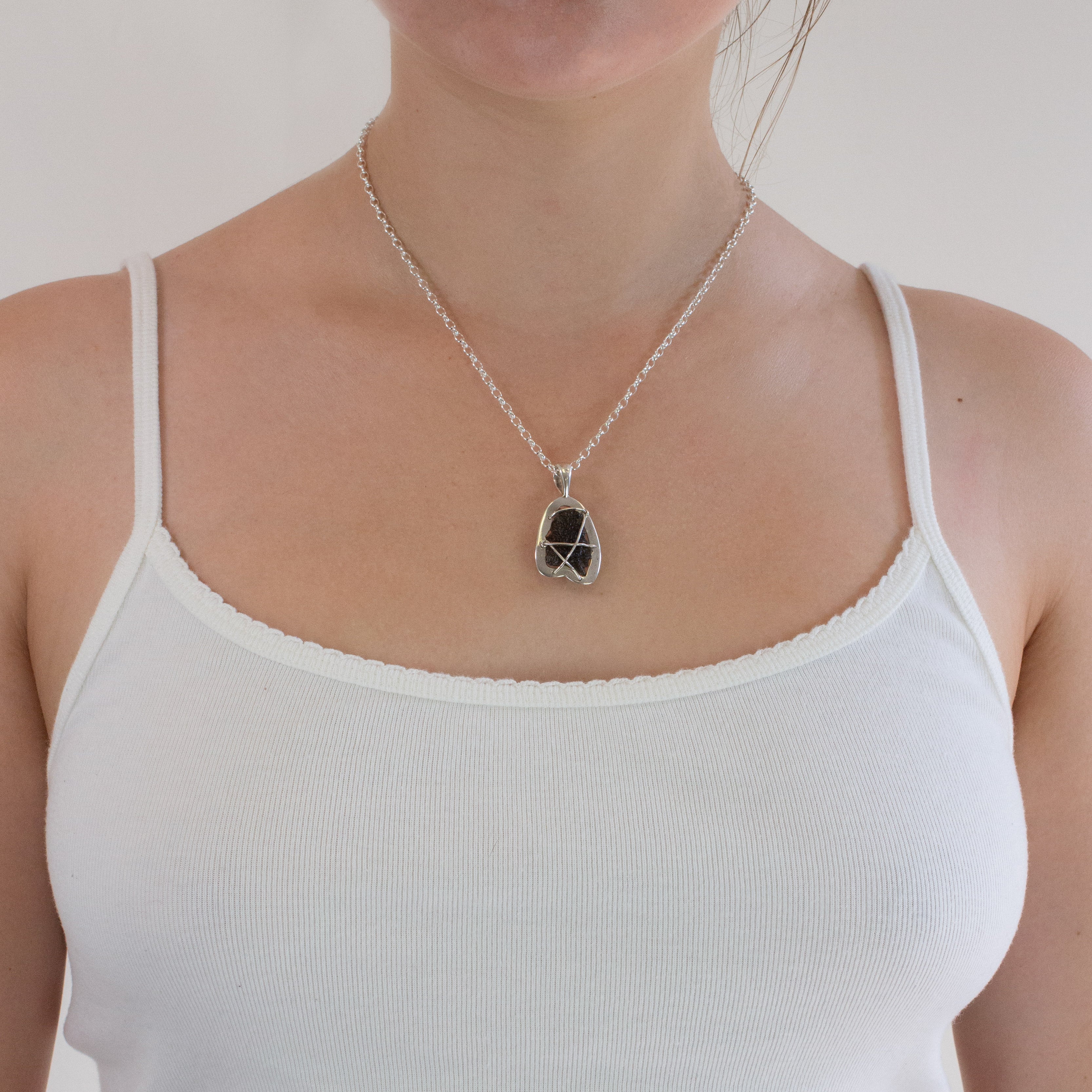 Moldavite necklace on model